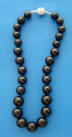 Black shell pearl graduated necklace with a sterling silver rhinestone clasp