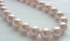 Landi pink south sea shell pearls - named after her to represent her strength and faith in her fight with breast cancer!