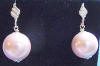 Sterling silver light pink shell pearl dangle stud earrings.