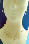 triple-strand bronze crystal pearl illusion necklace and leverback earrings